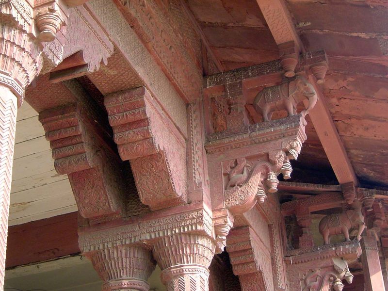 Various animals are carved into the brackets, here with elephants and peacocks.