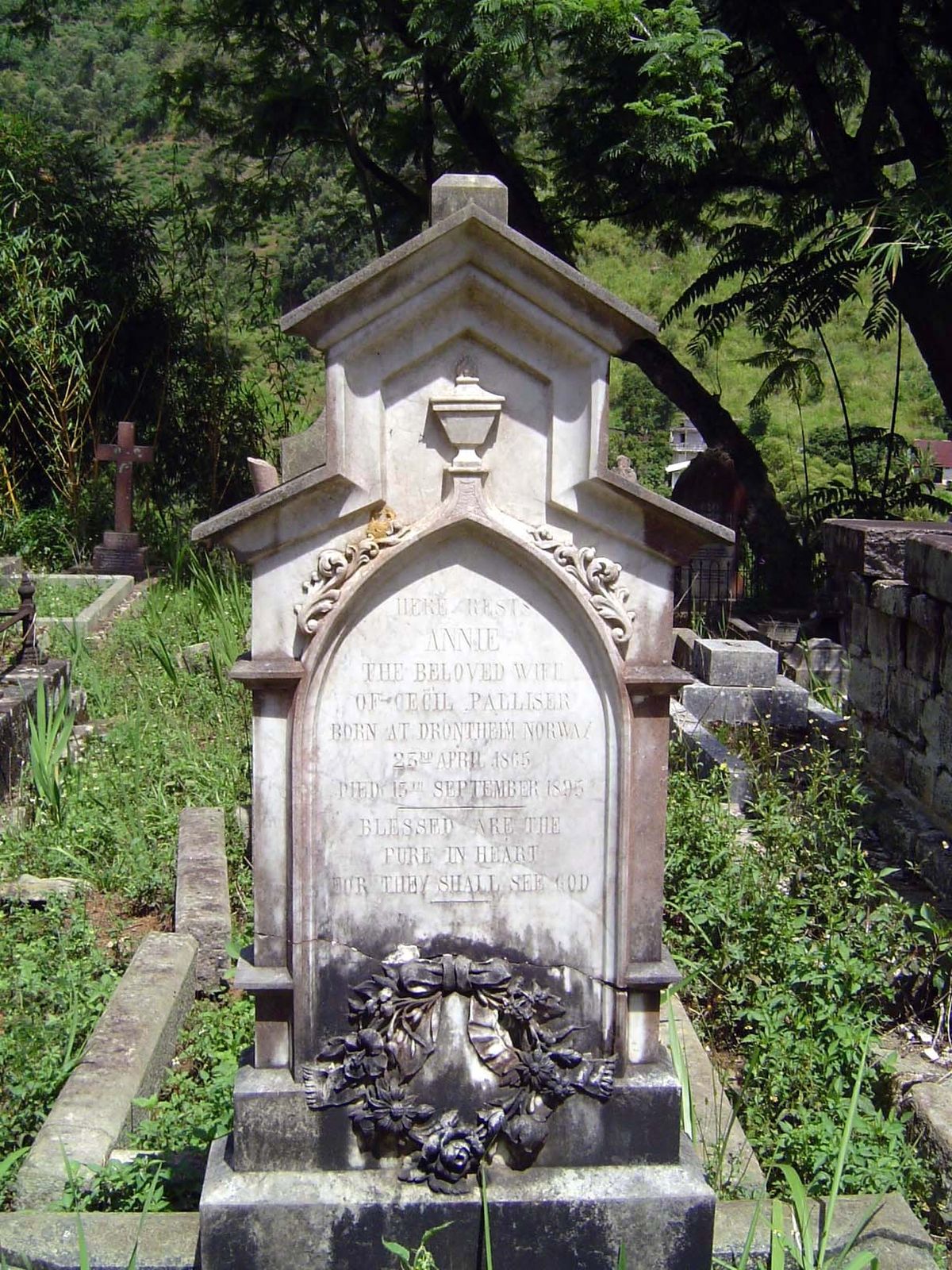 "Here lies Annie, the beloved wife of Cecil Palliser. Born at Drontheim, Norway, 23rd April 1865, Died 15th September, 1895."