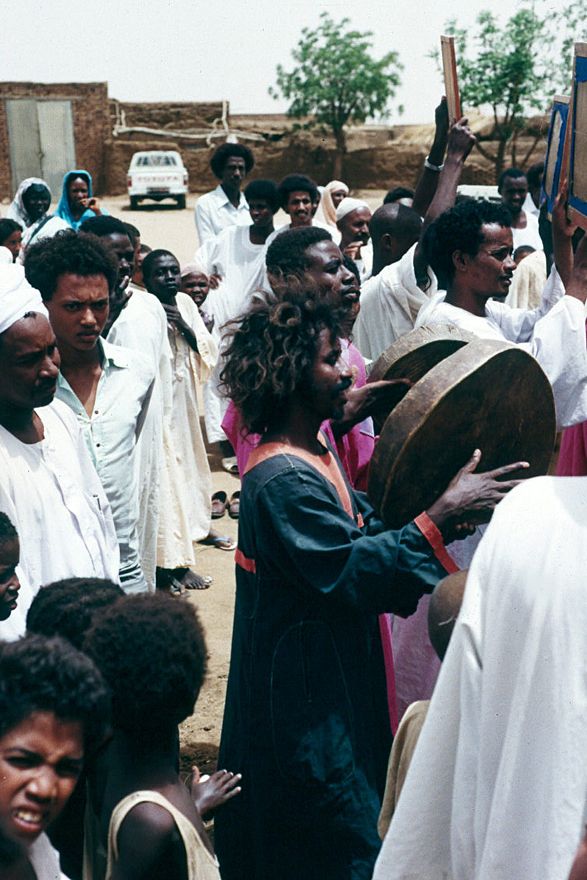 Shortly, a procession forms and heads to the mosque.