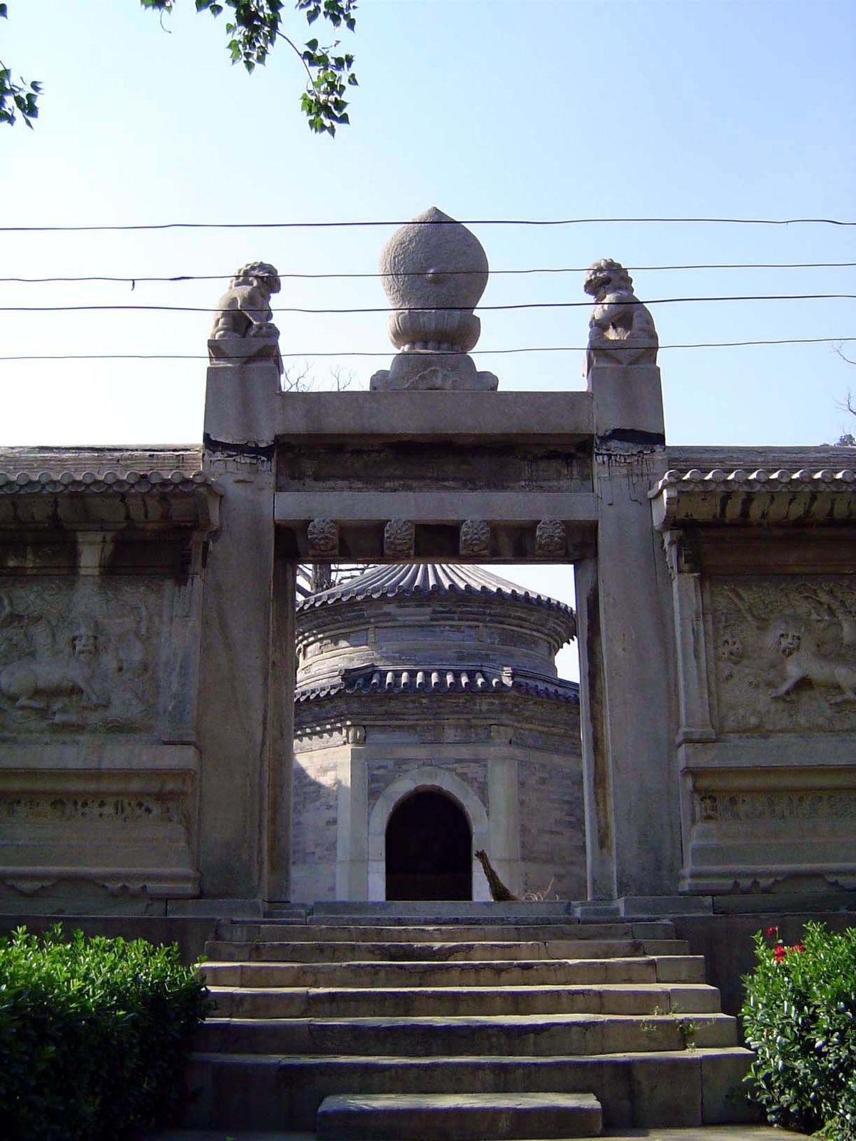 Yet another gate, with a circular stele pavilion behind it.