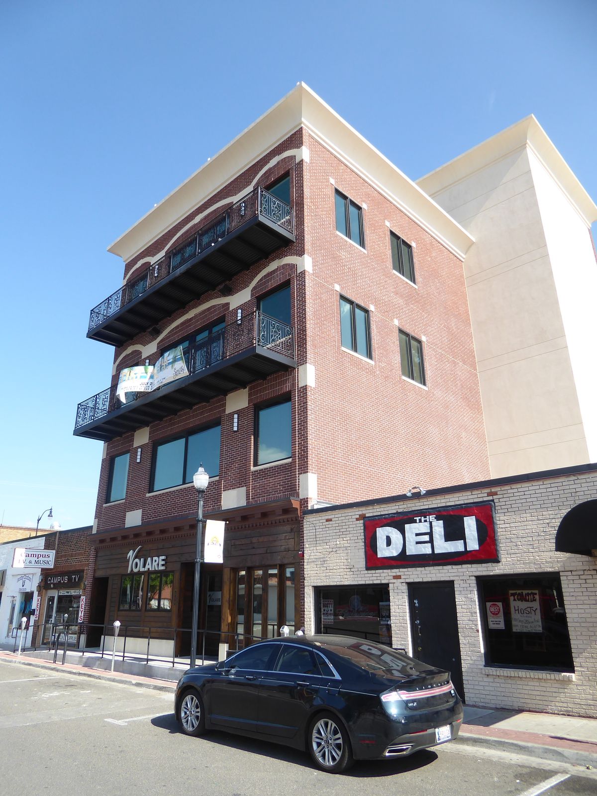 The restaurant opened with its kitchen on the second floor, offices on the third, and a rooftop bar. Will wonders never cease?