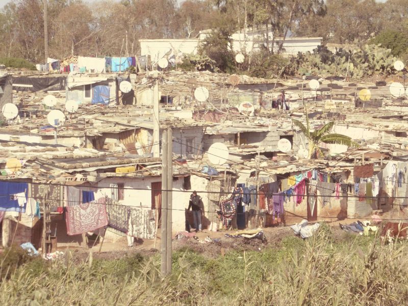 What catches your eye? Yes, it's the satellite dishes. Think the king is delighted that even slum-dwellers in his country have access to the