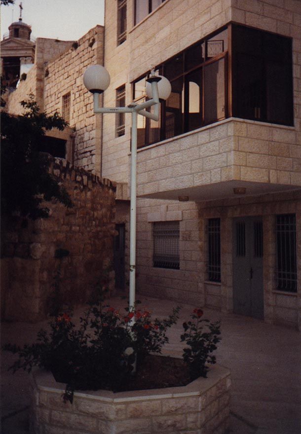 Another example, this one less than 100 yards from the Church of the Nativity, one of whose towers can be made out in the distance.