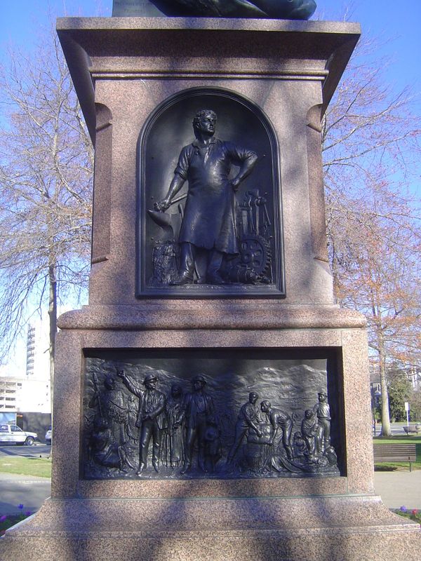 Perhaps the figures represent Edward Gibbon Wakefield and John Robert Godley. Wakefield was the man behind the New Zealand Company, which ha