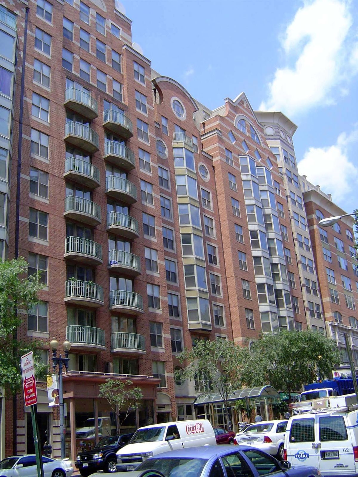 Nearby, a line of apartments invokes every geometrical shape known to man as it desperately seeks to establish some variety along its facade