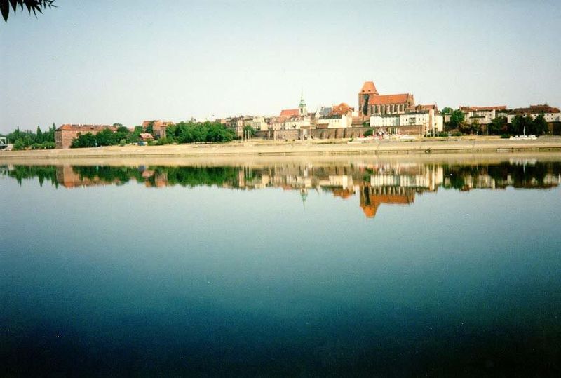 The Vistula River at Torun, with St. John's Church standing tall. It contains Copernicus' baptismal font.