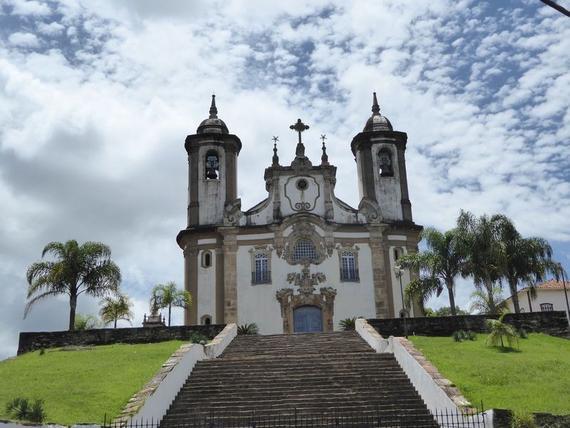 The Carmelite church is locked tight behind a fence also locked tight. The facade is rounded, though it's hard to see the curvature when you
