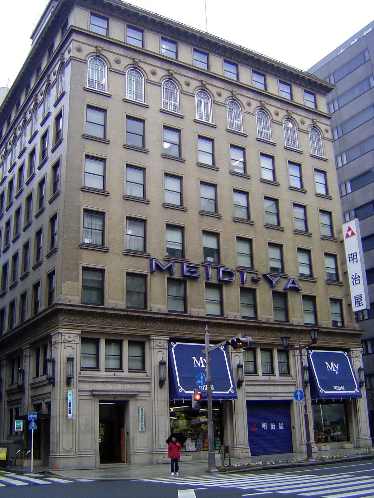 Meidi-ya, founded in 1885, is a chain of gourmet shops. This one, in Ginza, illustrates the 32-meter height limit imposed on Tokyo's buildin