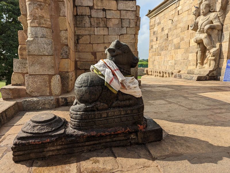 No intimidation here, only a friendly Nandi.  Original?  Almost certainly not.  The temple has a much larger and less friendly version just 