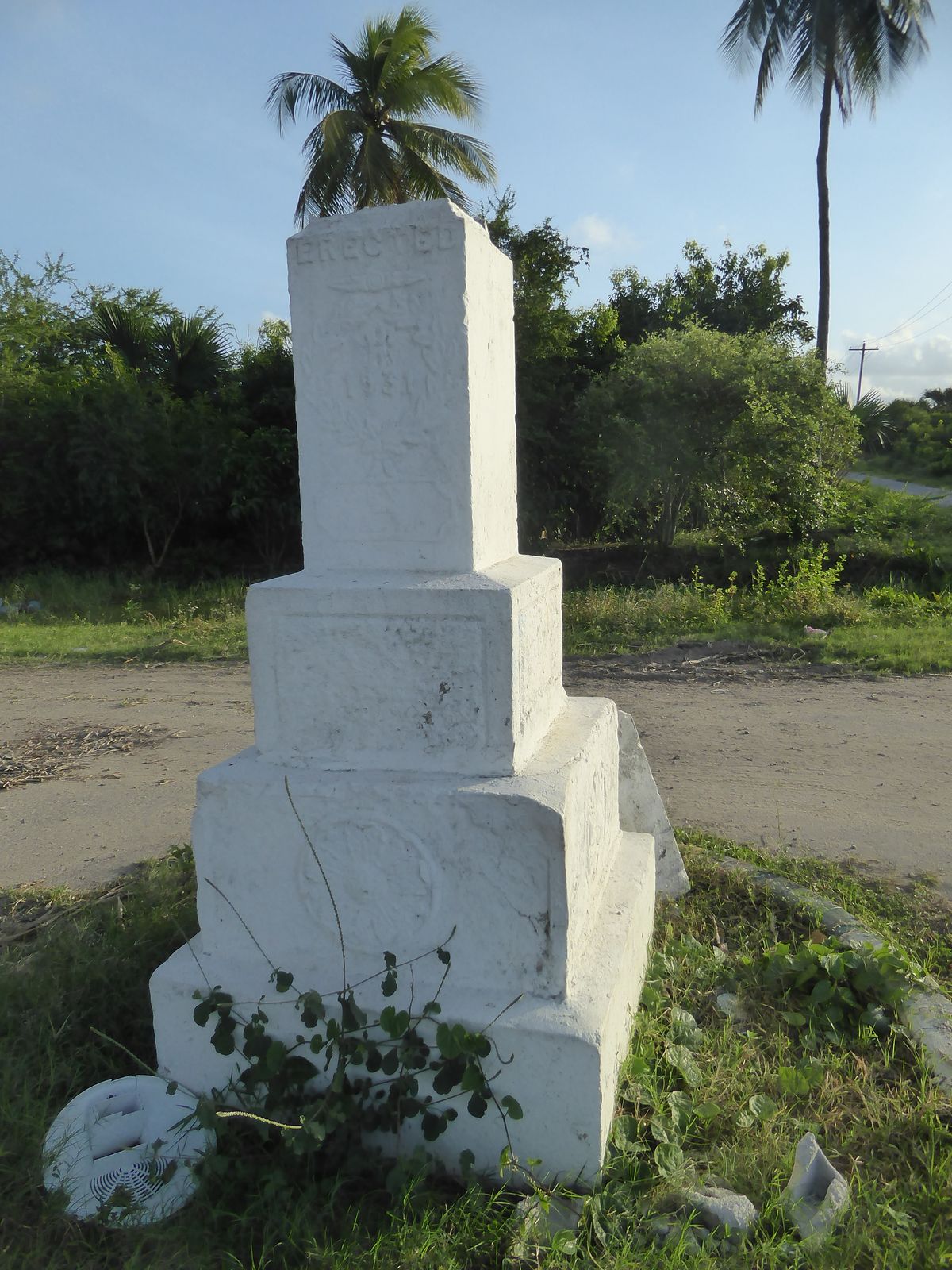 Near a crossroads in the cemetery, there's one of the few freestanding monuments. It's almost illegible but is clearly dated 1931 and was ap